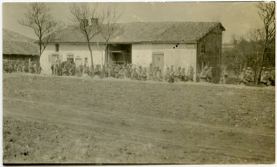 A Group of Soldiers Marching Past a House Next to a Dirt Road by Carl Michel